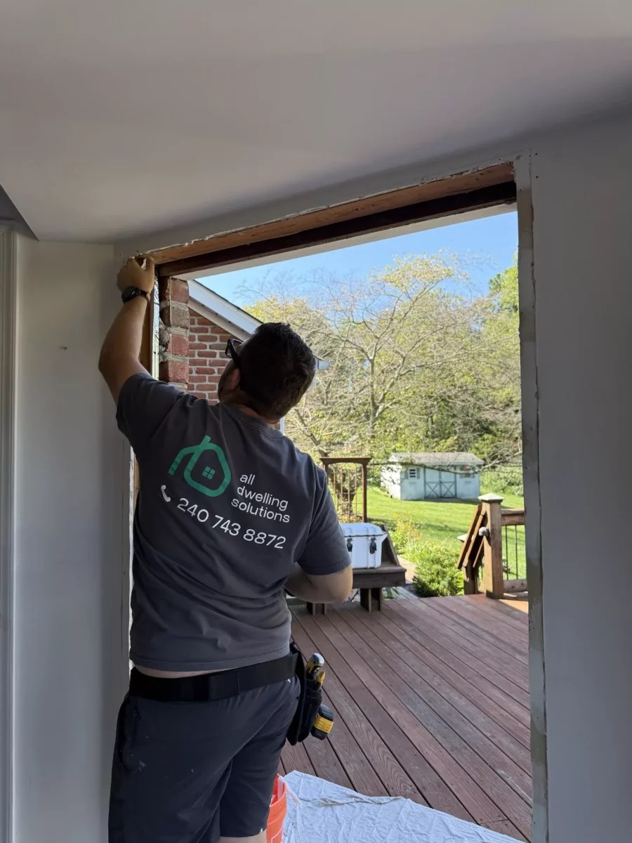 All Dwelling Solutions employee installing protection flash tape