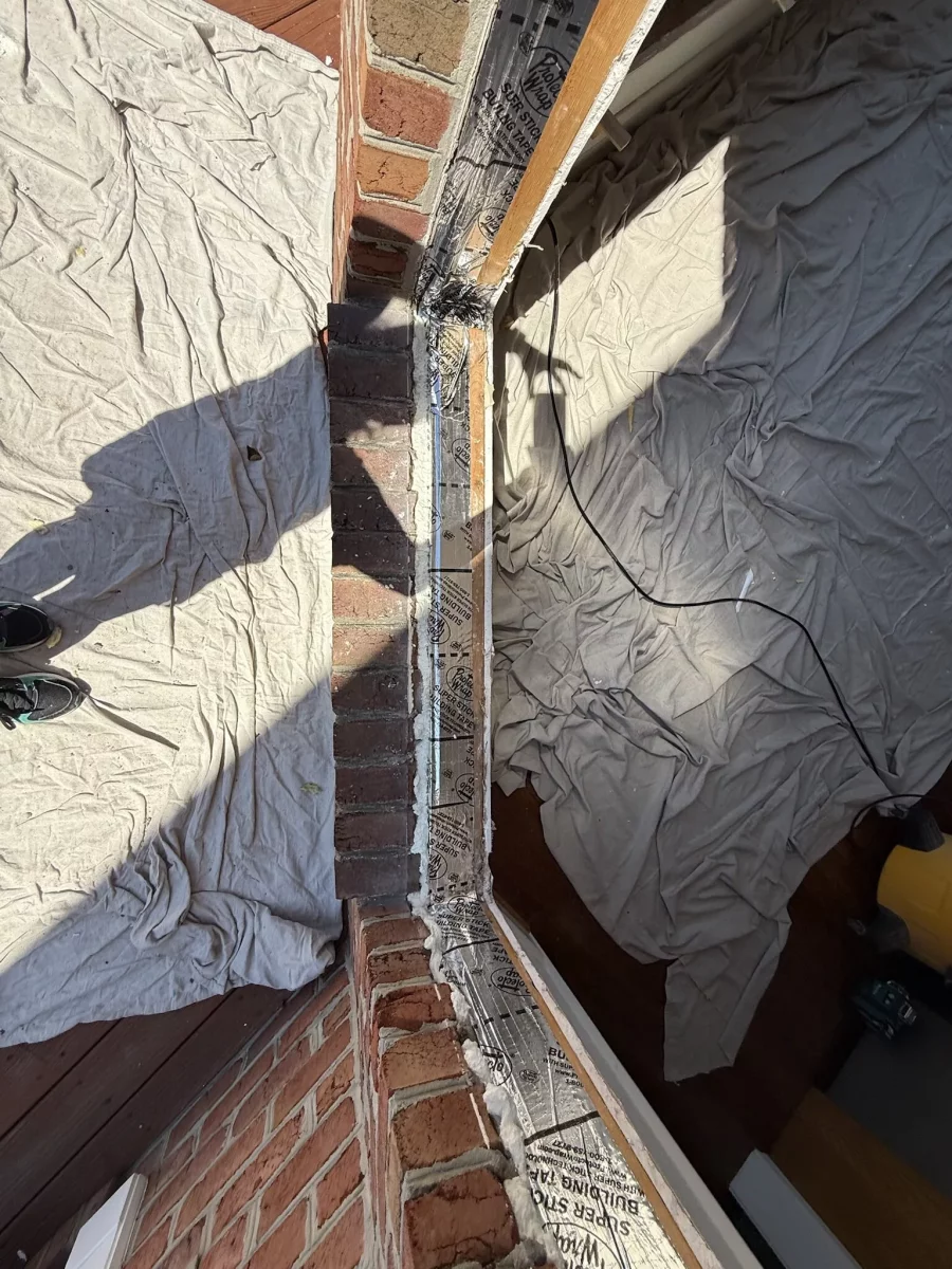 Window opening waterproofed with flashing tape before Oknoplast tilt-and-turn window installation in Monrovia, Maryland