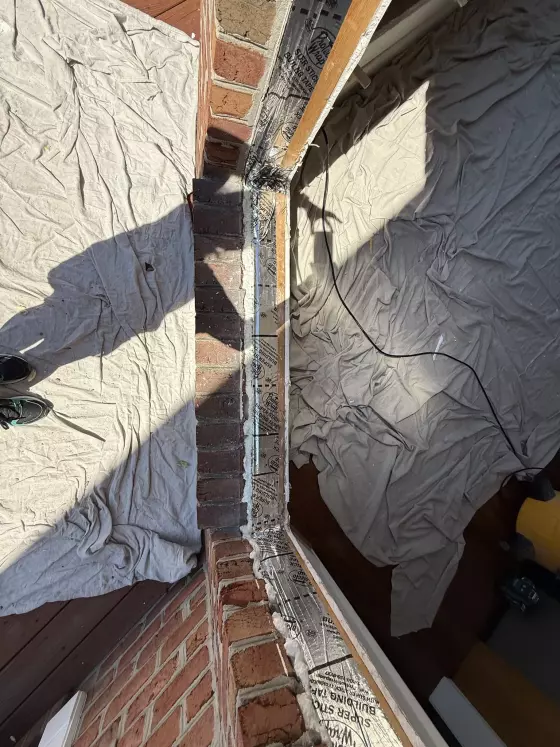 Window opening waterproofed with flashing tape before Oknoplast tilt-and-turn window installation in Monrovia, Maryland