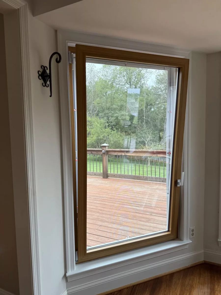 Interior view of a tilt and turn window with wood trim
