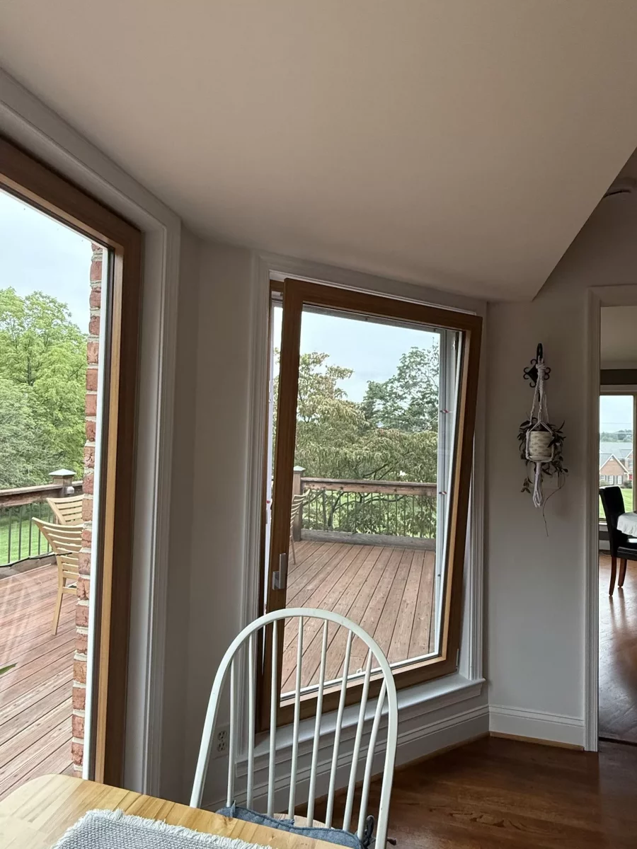 Interior view of tilt and turn window overlooking wooden deck