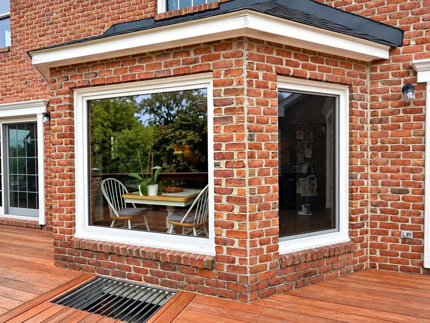 Completed Oknoplast tilt-and-turn and picture window installation on a brick home in Monrovia, Maryland