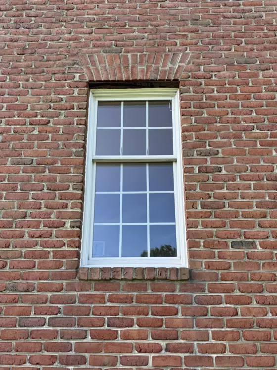 Old rotted Andersen window before full-frame replacement with a new Marvin Elevate window in Monrovia, Maryland