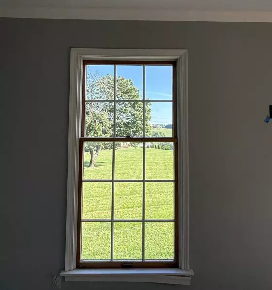 Old rotted Andersen window before full-frame replacement with a new Marvin Elevate window in Monrovia, Maryland.
