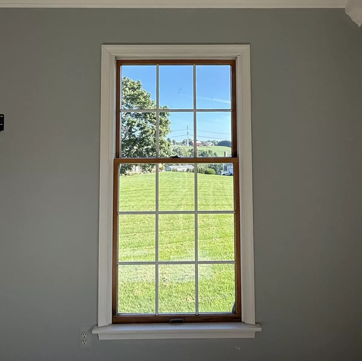 Old rotted Andersen window before full-frame replacement with a new Marvin Elevate window in Monrovia, Maryland.