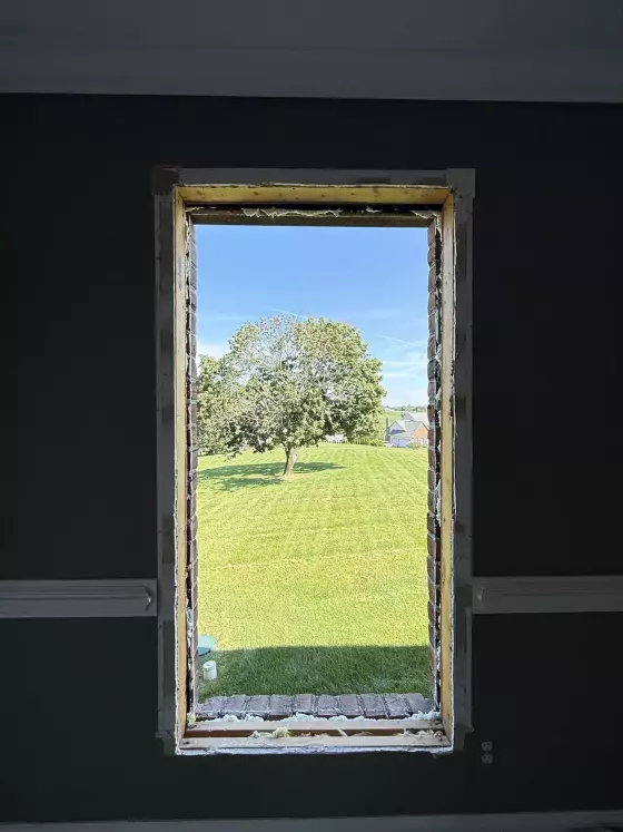 Interior wall with window opening prepared for installation