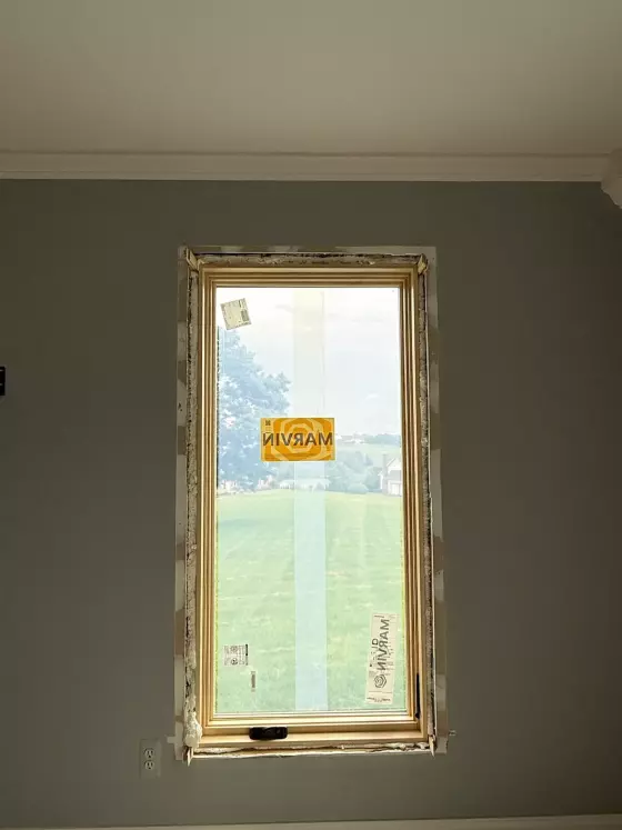 New window partially installed in interior wall