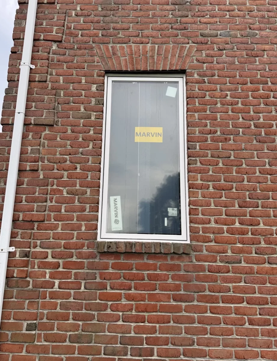 New window installed in brick exterior wall