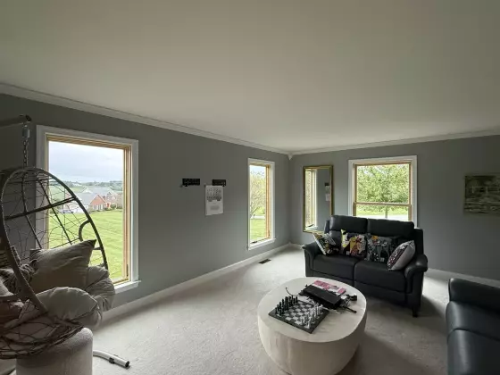 Completed Marvin Elevate full-frame window replacement, bringing more natural light and a clean finished look to the living room