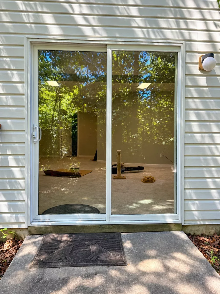 Completed sliding patio door glass replacement in Aspen Hill, MD, with new tempered glass installed in the existing door sash.