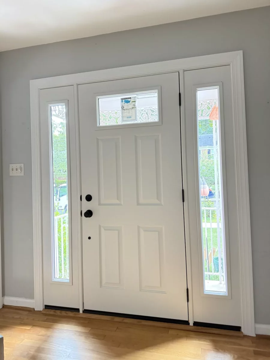 Finished interior of new ProVia entry door with beveled glass sidelites and new trim, no more winter drafts or plastic film