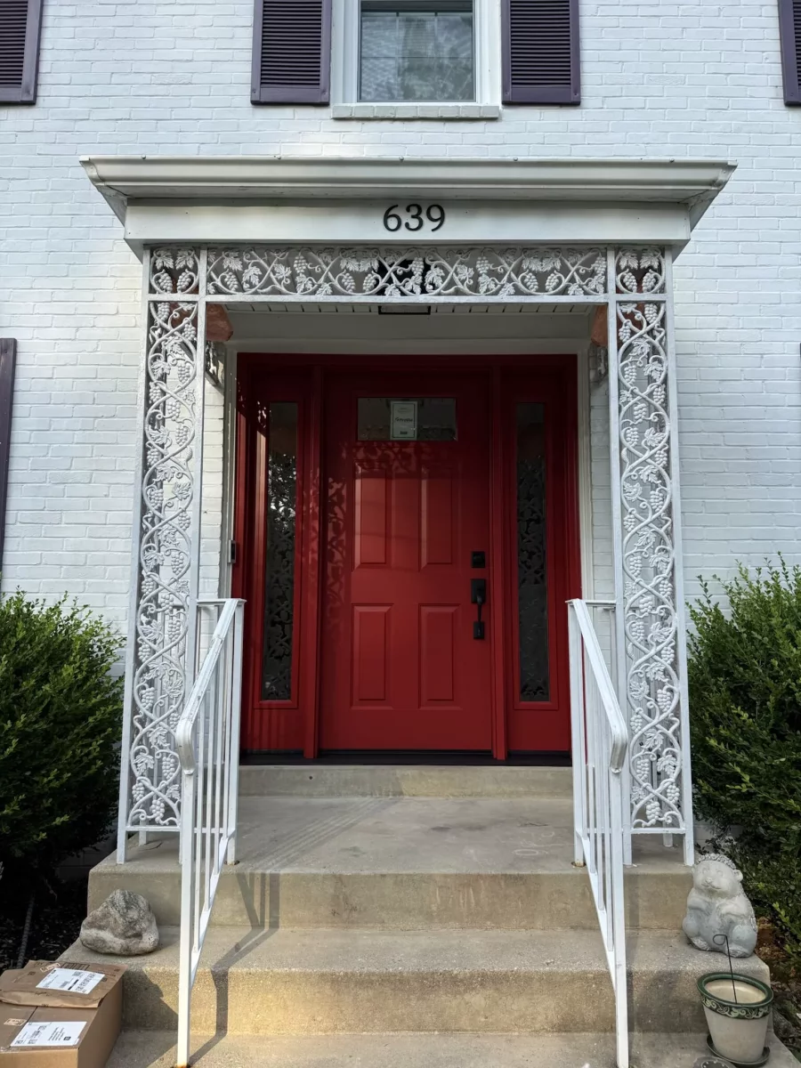 New red ProVia entry door with beveled glass sidelites and black handleset installed in Rockville, MD