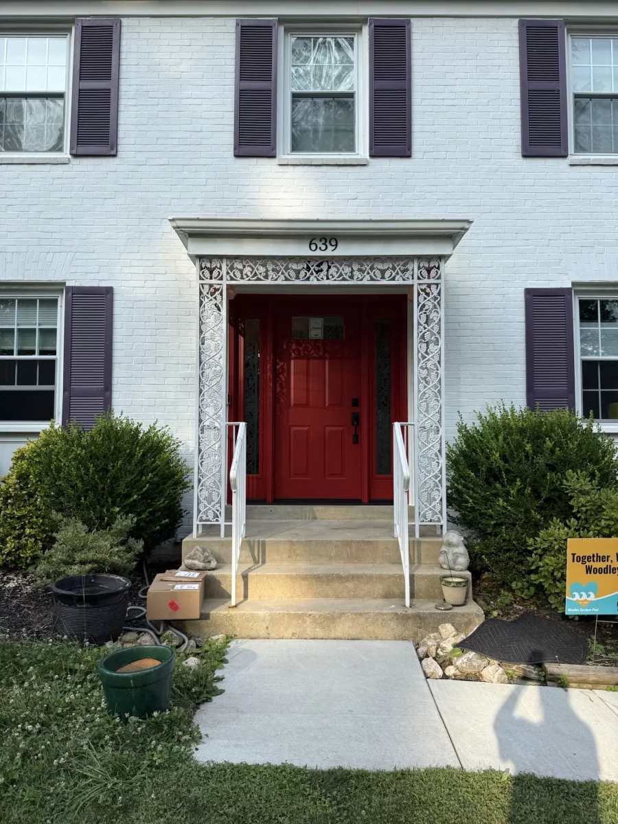 New red ProVia entry door with beveled glass sidelites and black handleset installed in Rockville, MD