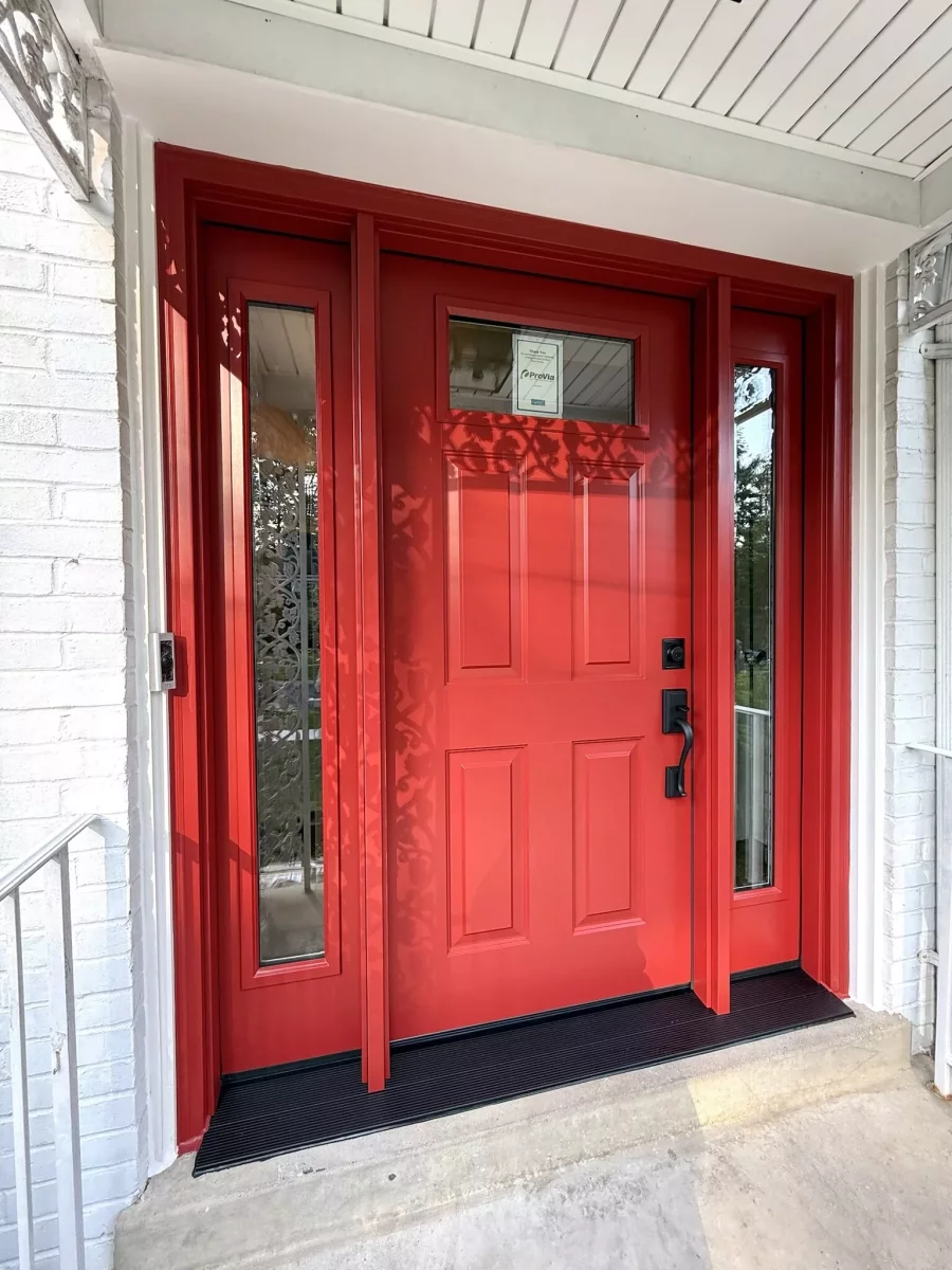 New red ProVia entry door with beveled glass sidelites and black handleset installed in Rockville, MD