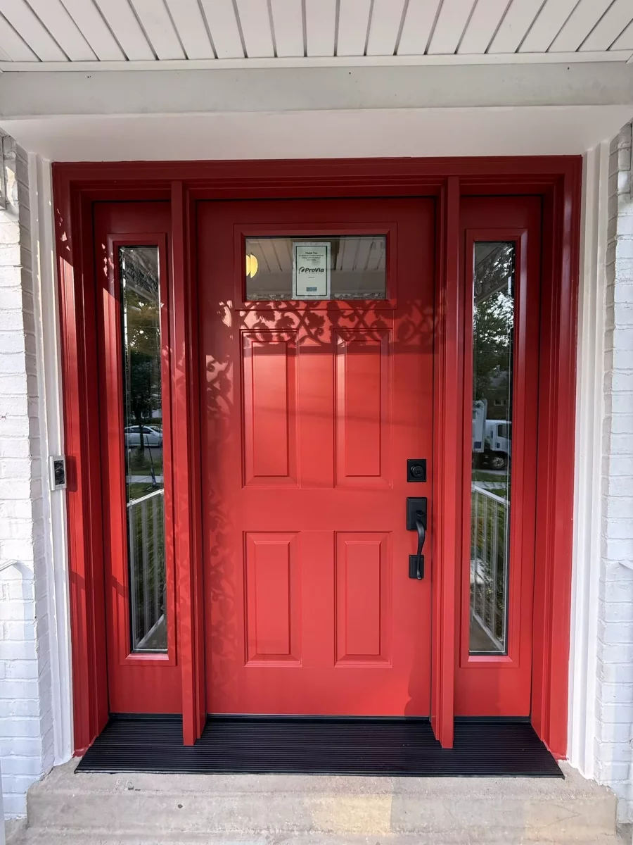 New red ProVia entry door with beveled glass sidelites and black handleset installed in Rockville, MD