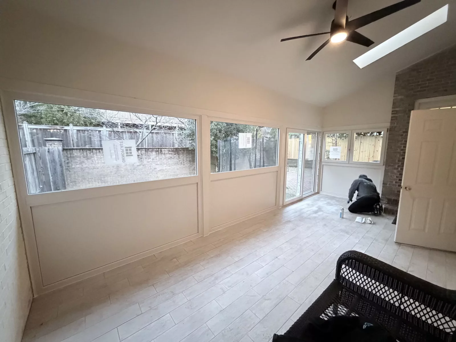 Interior of new year-round sunroom with Oknoplast windows, insulated panels, and sliding door in Potomac, MD