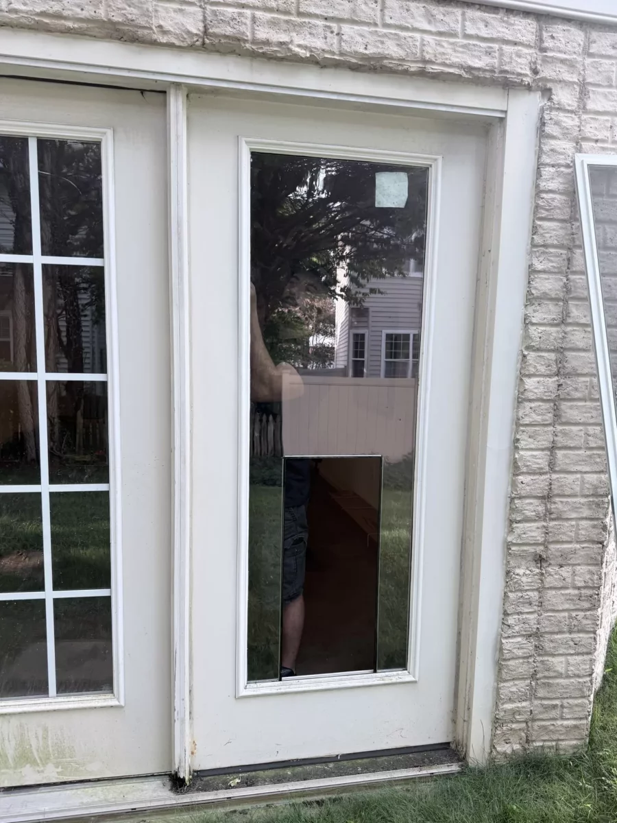 Exterior door with glass panel cut out for pet door installation