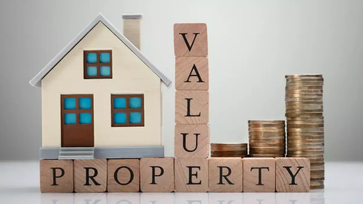 Concept image showing a small house model beside wooden blocks spelling “PROPERTY VALUE” and stacks of coins, symbolizing increased home value from repairs and maintenance.